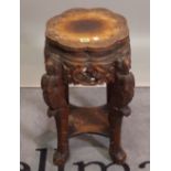 A Chinese carved hardwood jardiniere stand, 46cm wide x 61cm high.