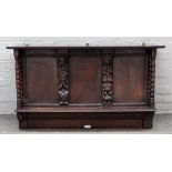 A 17th century and later oak wall shelf, with carved figural pilasters and turned supports,