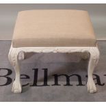 A Victorian style white painted rectangular footstool with acanthus moulded ball and claw feet,