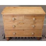 An early 20th century pine chest of two short and two long drawers, 97cm wide x 82cm high.