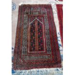 A Beluchistan prayer rug, the mehrab with a flowering tree, three minarets to arch,