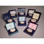 A group of eight 'Halcyon Days' enamel trinket boxes, boxed, (8).