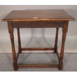 An 18th century style oak side table on turned block supports, 68cm wide x 69cm high.