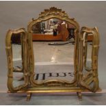 An Italian polychrome painted triptych dressing table mirror, 90cm wide x 79cm high.