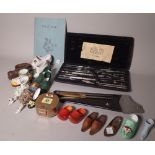 A group of mostly 19th century porcelain models of shoes, a set of cased balance scales,