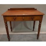 A Victorian mahogany two drawer side table on turned supports, 88cm wide x 74cm high.