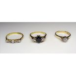 A gold, sapphire and diamond set three stone ring,