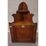A late 19th century pine and fruitwood hanging corner cupboard, 36cm wide x 61cm high.