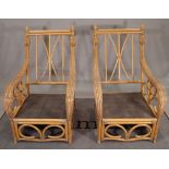 A pair of 20th century bamboo low armchairs with padded arms, 68cm wide x 105cm high, (2).