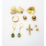A group of mostly 9ct gold jewellery, comprising; two brooches, a gem set pendant cross,