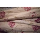 A pair of lined and interlined floral curtains, 150cm wide x 148cm drop.