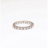 A diamond set full eternity ring, mounted with circular cut diamonds (two diamond lacking),