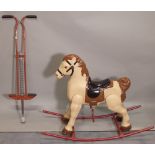 An early 20th century painted rocking horse and a vintage po-go stick, 105cm wide x 68cm high, (2).