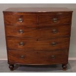 A Regency mahogany bowfront chest, with two short and three long graduated drawers on bun feet,