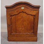 An Edwardian 19th century inlaid mahogany arch topped music cabinet with panelled door on plinth