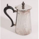 A silver hot water jug, of tapered cylindrical form,