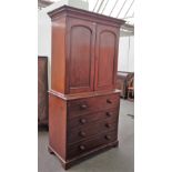 A George III mahogany secretaire cabinet, the pair of arch panel doors,