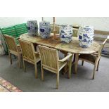 A hardwood garden oval extending table, 100cm wide x 182cm long x 222cm long extended,