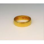 A 22ct gold plain wedding ring, London 1966, ring size R, weight 7.6 gms.