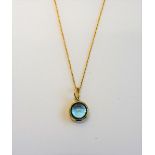 A Tiffany & Co Paloma Picasso 18ct gold and cabochon blue topaz single stone pendant,