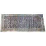 An unusual North West Persian Kelleh carpet, the dark indigo field with an allover herate design,