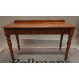 A Victorian mahogany two drawer side table on turned supports, 23cm wide x 78cm high.