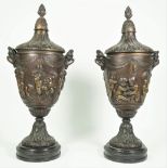 After Clodin, a pair of French patinated bronze urns and covers,