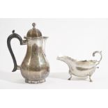 Silver, comprising; a hot water jug of octagonal baluster form, with an ebonised handle,