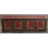 An early 20th century painted low sideboard with four panelled doors, 186cm wide x 61cm high.