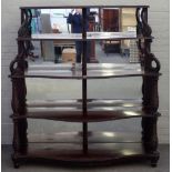 A 19th century Anglo-Portuguese mahogany mirror back display shelf, on five serpentine tiers,
