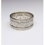 A diamond set wide band full eternity ring, in a pierced openwork design,