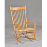 Moblier, Made in Denmark; a beech framed stick back rocking chair, 60cm wide x 108cm high.