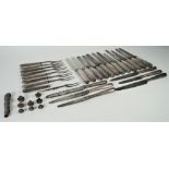 A group of table flatware, comprising; sixteen steel bladed table knives,