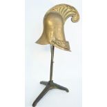 A Continental brass helmet, mid-19th century,