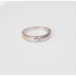 An 18ct white gold ring, mounted with a circular cut diamond, ring size K, gross weight 4.