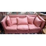 A Knole sofa with pattern pink upholstery, 225cm wide x 97cm high.