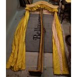 A Victorian style white painted bed pelmet with lined and interlined yellow silk curtains by 'Jane