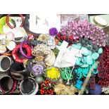 A large collection of costume jewellery, including; bangles, bead and other necklaces, rings,