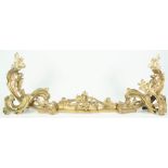 A Louis XV style brass fender of foliate scroll form in three adjustable parts, 108cm wide.