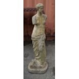 An early 20th century reconstituted stone female figure in standing pose, 97cm high.