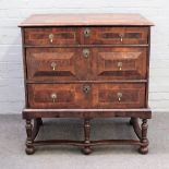A late 17th century walnut and oyster veneered chest on stand, with three long graduated drawers,
