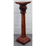 A Victorian mahogany pedestal, the square top over tapering carved column,