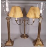 A near pair of early 20th century brass Corinthian column table lamps,