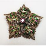 A gold, diamond, ruby set and green enamelled brooch,