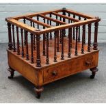 A Victorian figured walnut four division Canterbury, with turned supports and single draw base,