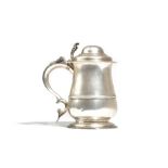 A late George II silver tankard of baluster form, the domed lid with an openwork thumbpiece,