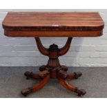 A Regency rosewood card table, the 'D' shaped top on open 'U' shaped mount and four scroll supports,