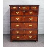 An early 18th century walnut chest on stand with three short over three long graduated drawers,