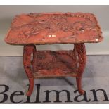 An early 20th century red lacquer Chinese two tier table, 75cm wide x 69cm high.