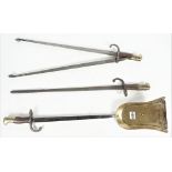 A set of three French bayonet fire tools, 19th century, each with wooden brass mounted handles,